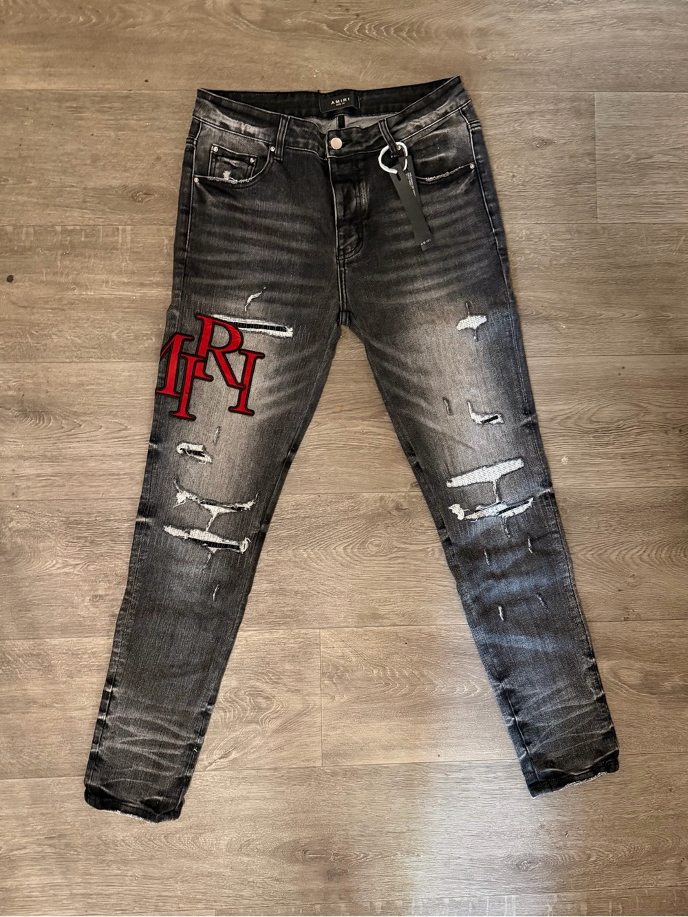 AMIRI Black Slim Ripped Jeans with Red Logo Patch